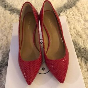 Red Calvin Heels with gold detail on back